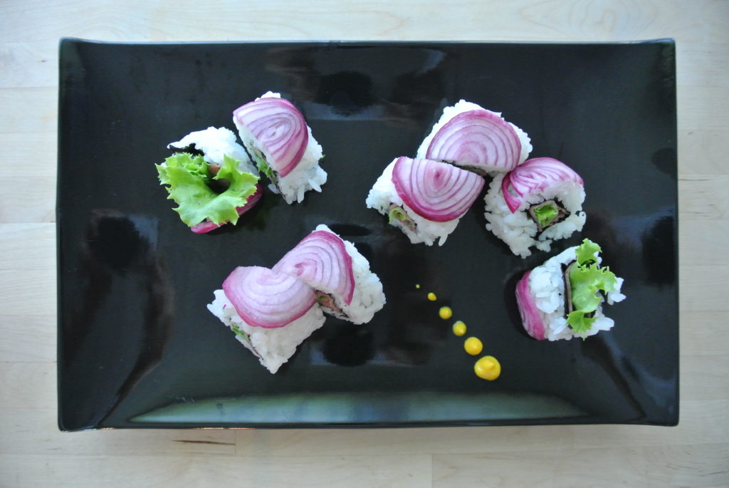inside out roll sushi with red onion